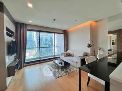 Modern living room with city view, sleek furniture, and wooden flooring.
