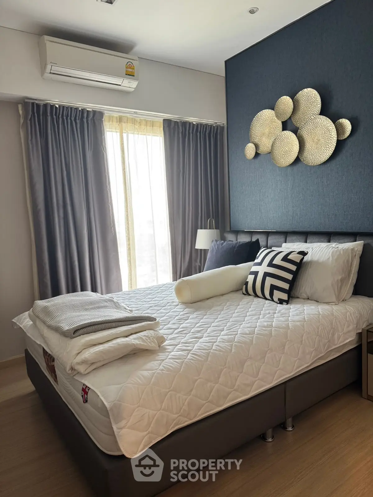 Modern bedroom with stylish decor and natural light