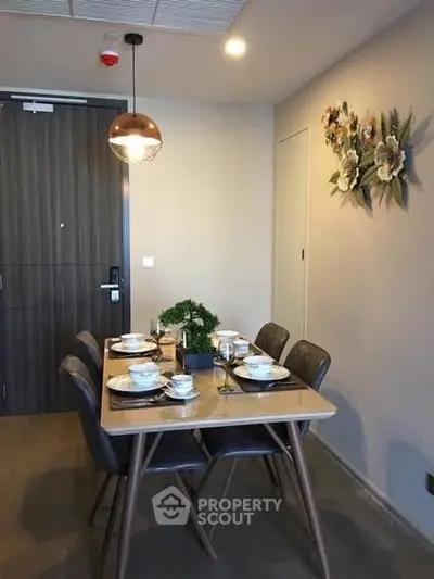 Modern dining area with elegant table setting and stylish decor