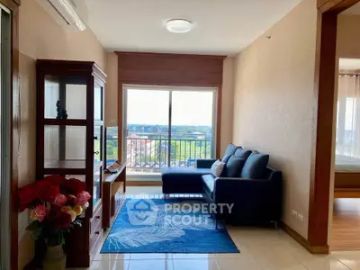 Bright living room with modern decor and balcony view