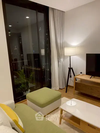 Modern living room with stylish furniture and large window view