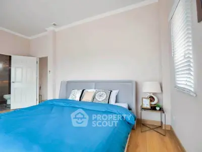 Spacious bedroom with modern decor and ensuite bathroom