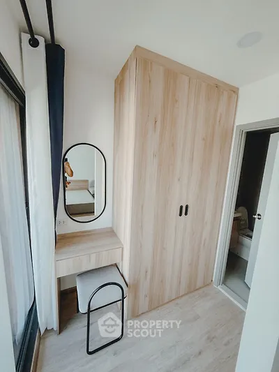 Modern bedroom with wooden wardrobe and stylish vanity mirror