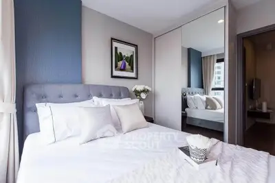 Modern bedroom with elegant decor and large mirror wardrobe