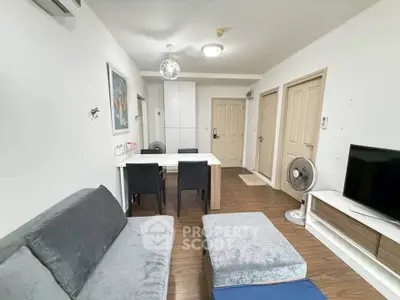 Modern living room with stylish furniture and wooden flooring