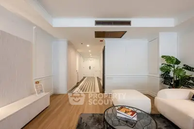 Spacious modern living room with elegant decor and wooden flooring