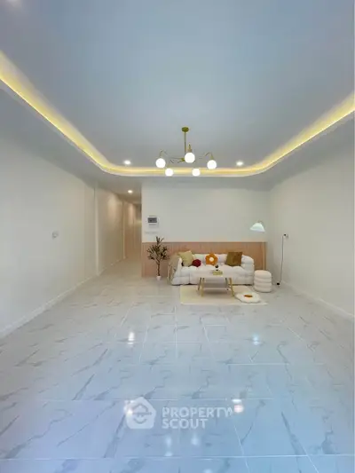 Spacious modern living room with elegant lighting and stylish furniture