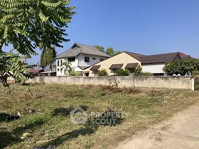Spacious plot with potential for development near residential homes.