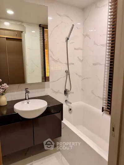 Modern bathroom with elegant marble tiles and sleek fixtures