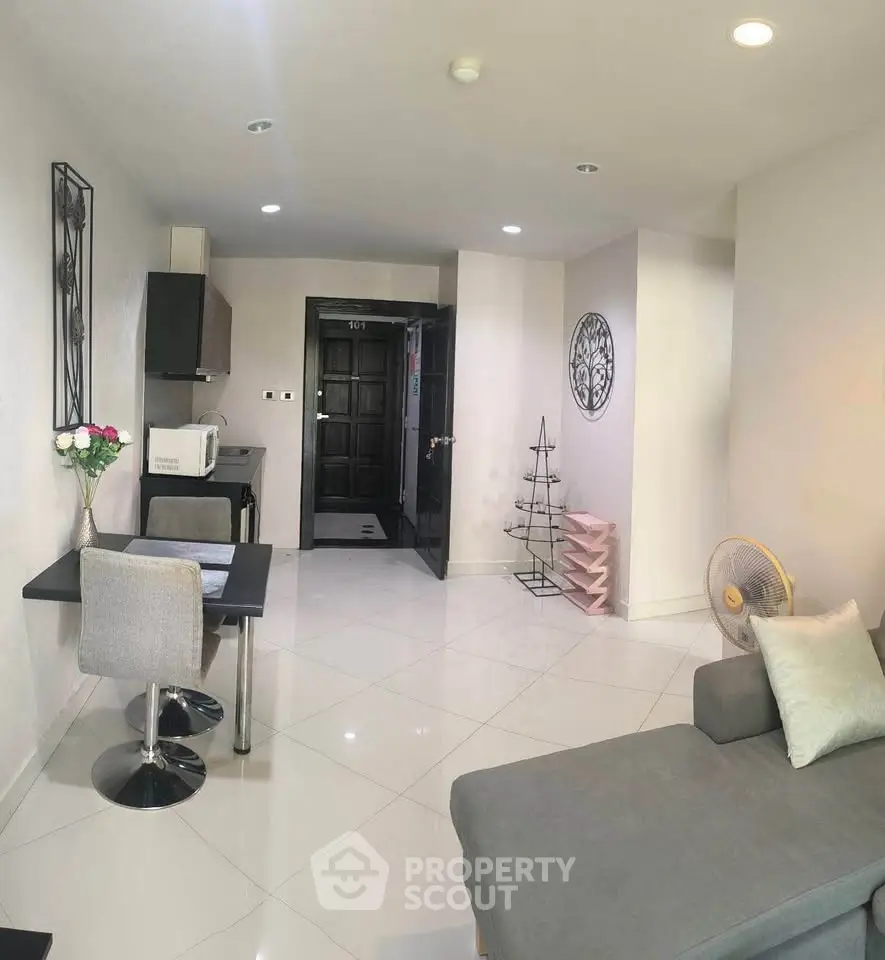 Modern living room with sleek furniture and open layout, perfect for urban living.