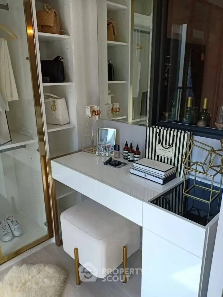 Luxurious walk-in closet with elegant vanity and stylish storage solutions.