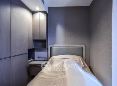 Cozy compact bedroom with modern built-in storage and elegant design.