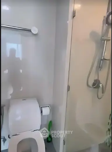 Modern bathroom with shower and toilet in sleek design