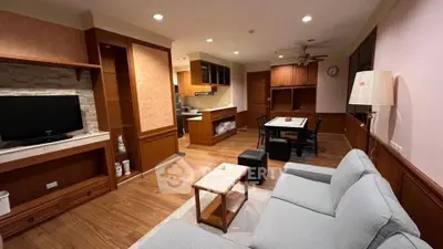 Spacious living room with open kitchen layout and modern furnishings