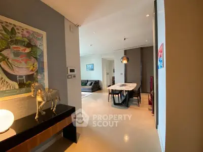 Spacious modern living and dining area with elegant decor and stylish furniture.