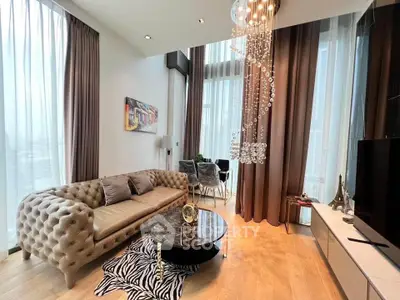 Luxurious high-ceiling living room with elegant decor and floor-to-ceiling windows