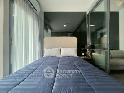 Modern bedroom with glass wall and stylish decor