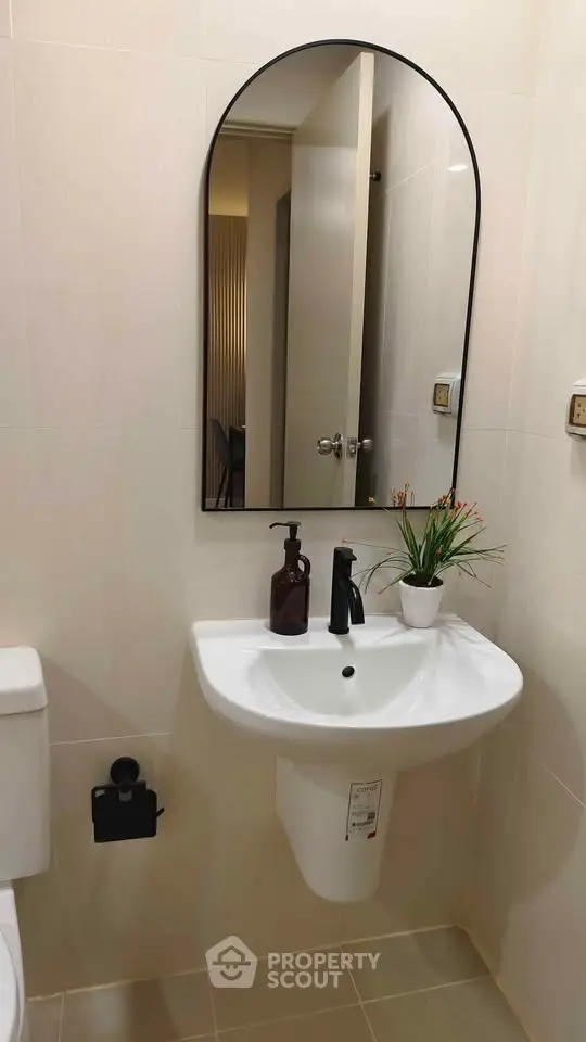 Modern bathroom with sleek sink and stylish mirror