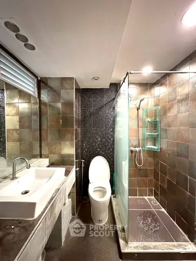Modern bathroom with sleek design and glass shower enclosure