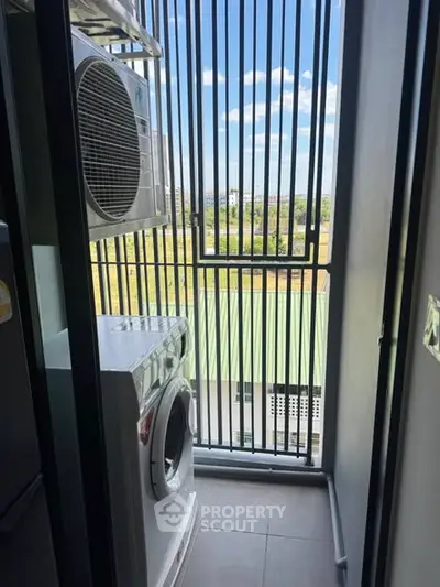 Compact laundry area with washing machine and dryer in a modern apartment balcony.