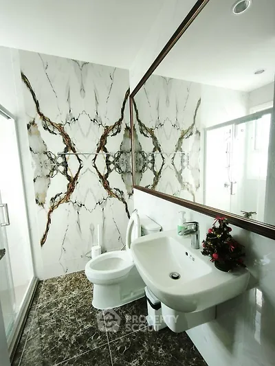 Luxurious bathroom with elegant marble accents and modern fixtures