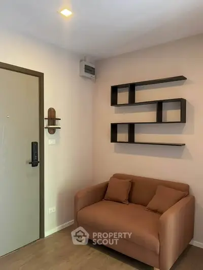 Cozy living room with modern shelving and comfortable sofa in a stylish apartment.