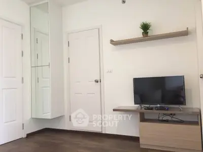 Modern living room with sleek TV setup and minimalist decor