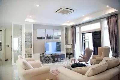 Luxurious modern living room with elegant furniture and large windows