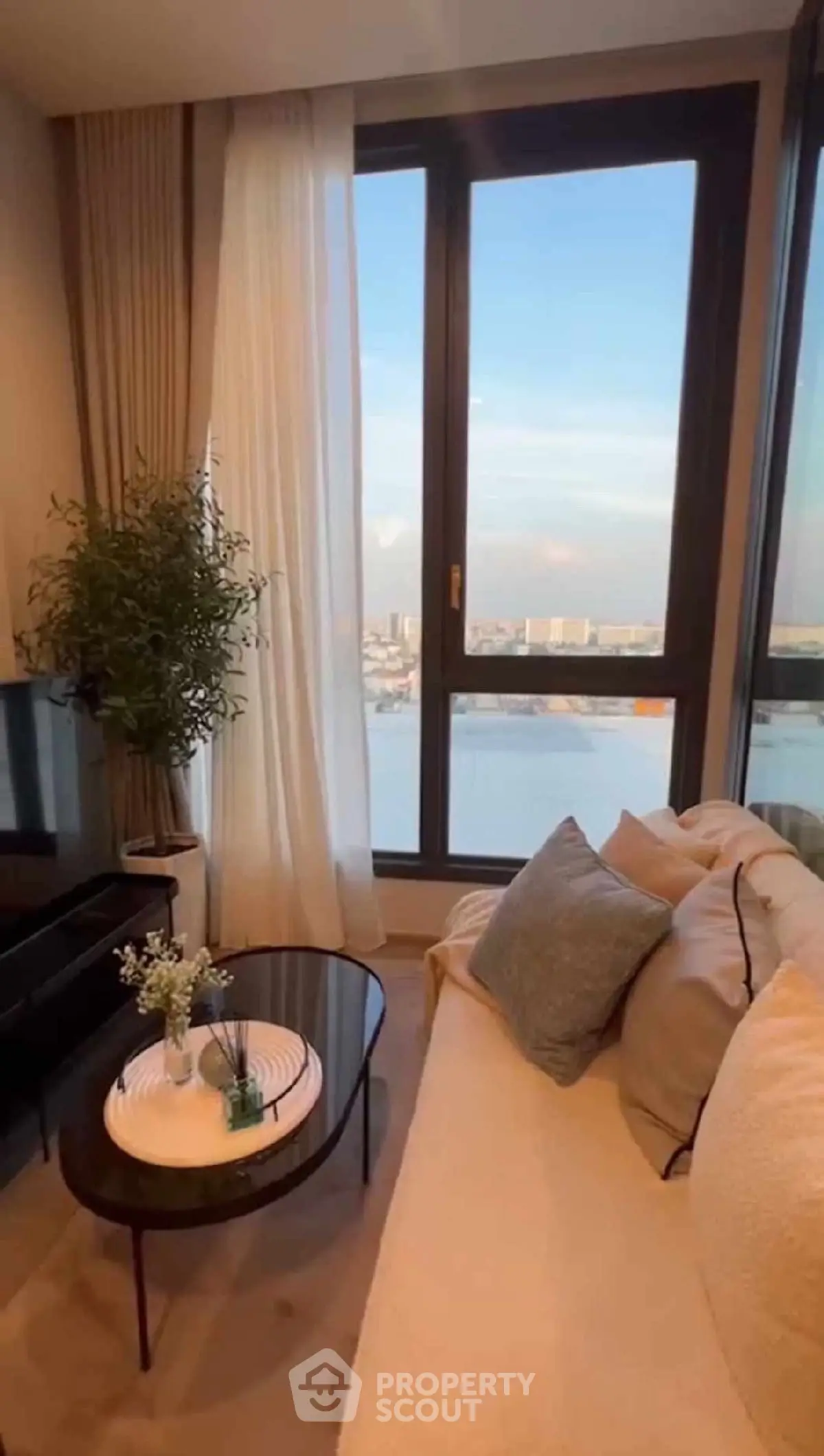 Luxurious living room with stunning city view and elegant decor
