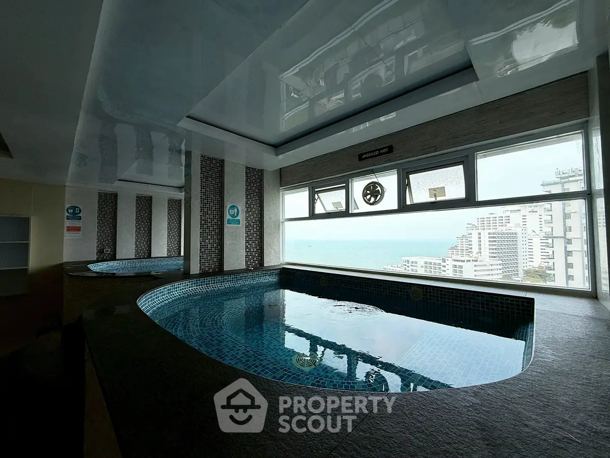 Luxurious indoor pool with stunning ocean view in high-rise building