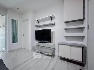 Modern living room with sleek TV setup and stylish shelving