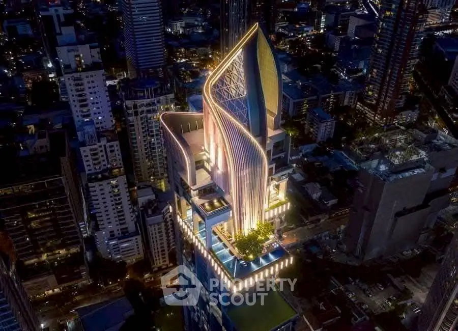 Stunning aerial view of a modern skyscraper with unique architectural design in a vibrant cityscape.