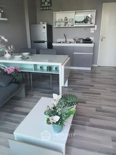 Modern open-plan kitchen and living area with sleek design and stylish decor