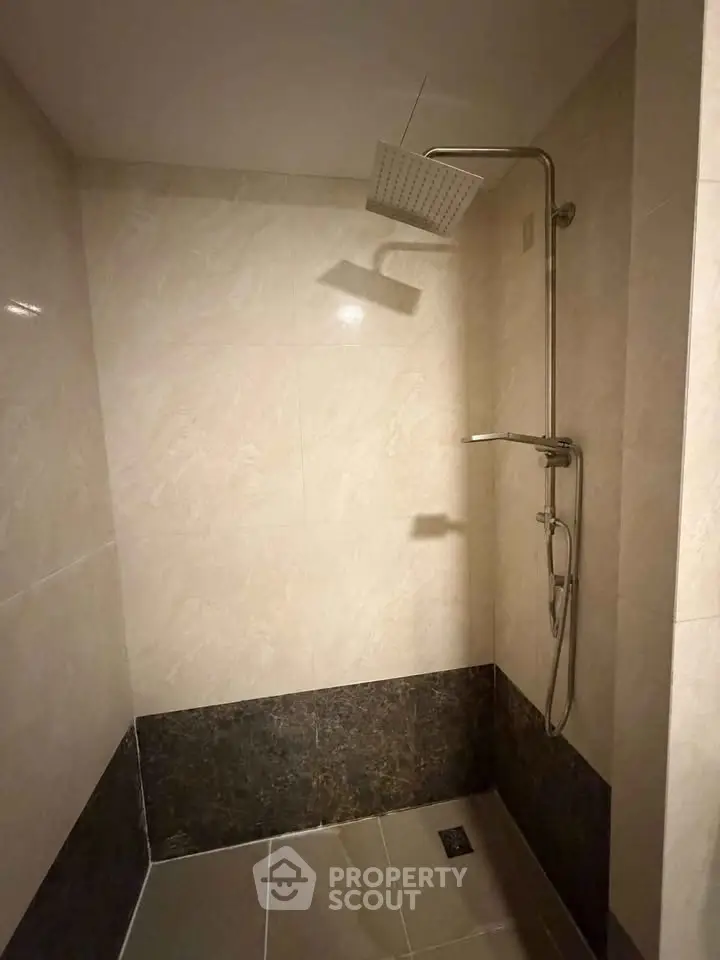 Modern bathroom shower with sleek tile design and rainfall showerhead