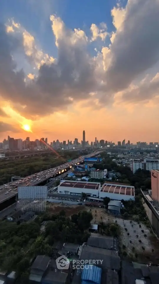 Stunning cityscape view at sunset with skyline and lush greenery, perfect for urban living enthusiasts.
