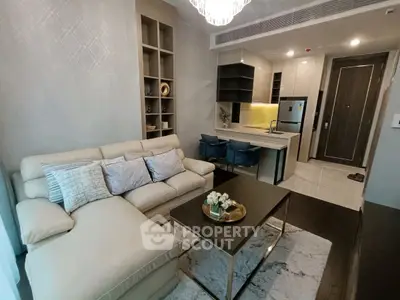 Modern living room with open kitchen and stylish decor