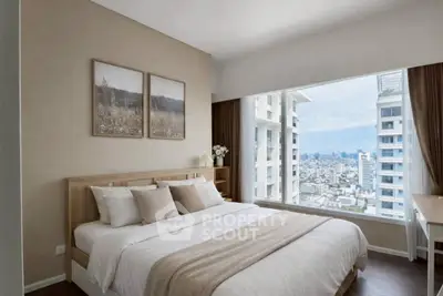 Luxurious bedroom with stunning city view and elegant decor