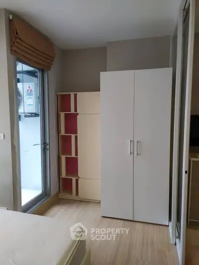 Cozy bedroom with modern wardrobe and natural light