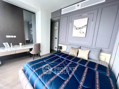 Luxurious bedroom with elegant decor and modern furnishings, featuring a plush bed and stylish vanity area.