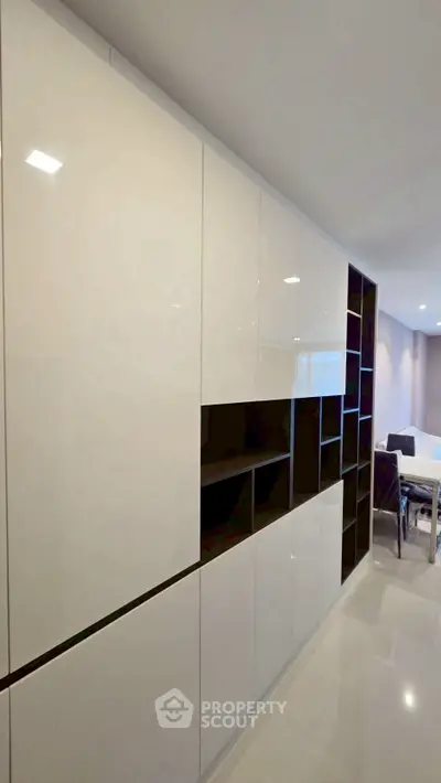 Modern interior with sleek built-in storage and open living area