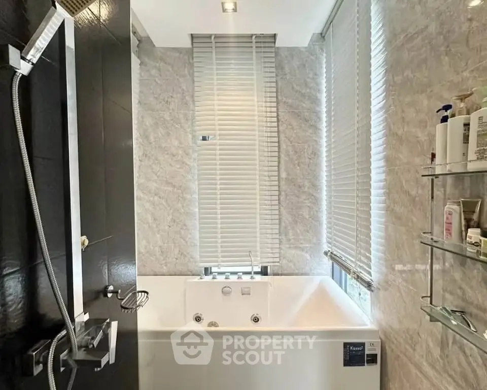 Luxurious bathroom with modern bathtub and sleek design, perfect for relaxation and comfort.