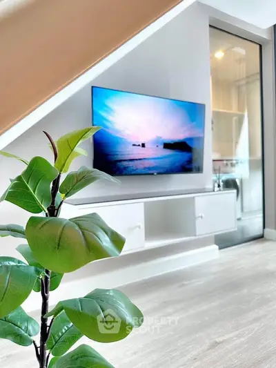 Modern living room with sleek TV setup and stylish decor
