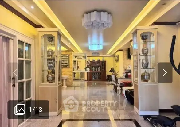 Luxurious living room with elegant lighting and decorative display cabinets