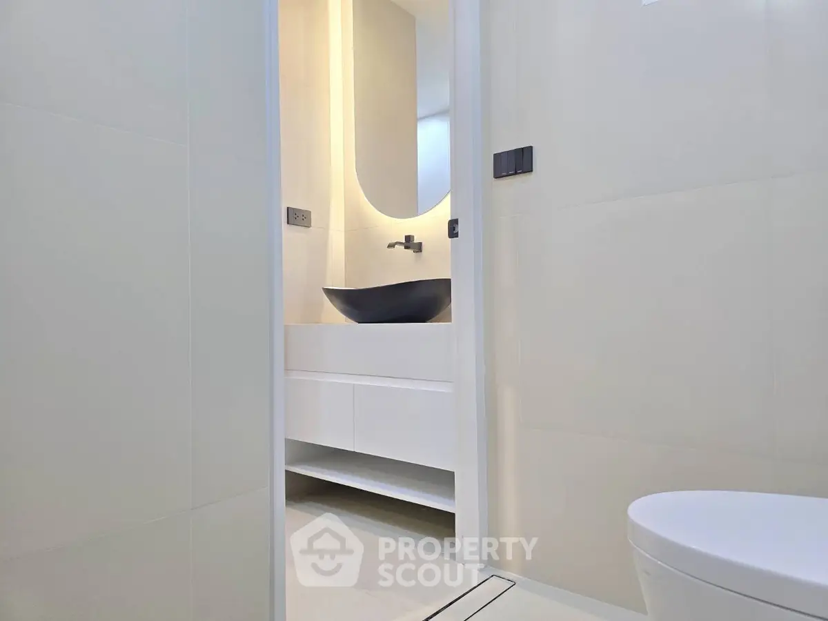 Modern minimalist bathroom with sleek fixtures and elegant design