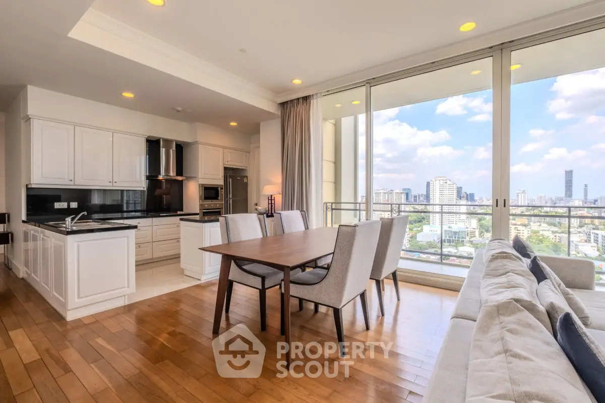 Spacious open-plan living and dining area with city view in modern apartment