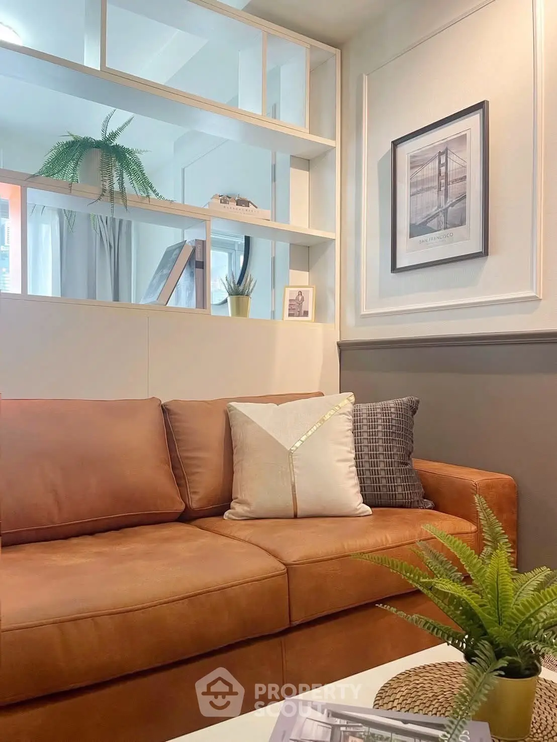 Stylish living room with modern decor and cozy brown sofa, perfect for relaxation and entertaining.