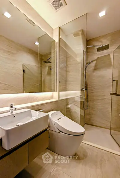 Luxurious modern bathroom with sleek fixtures and glass shower enclosure