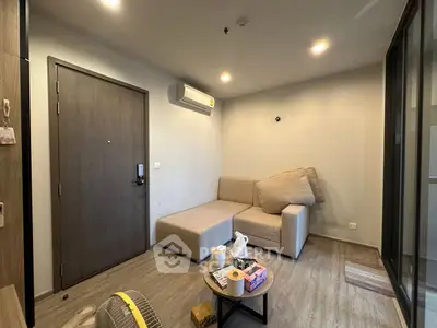 Modern living room with minimalist decor and air conditioning