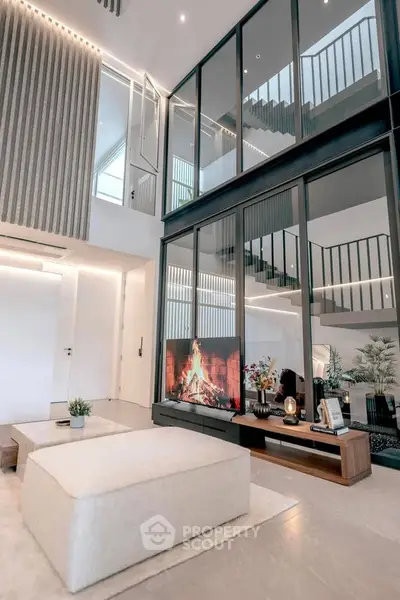 Luxurious modern living room with high ceilings and elegant decor