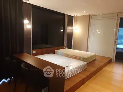 Modern bedroom with platform bed and stylish lighting